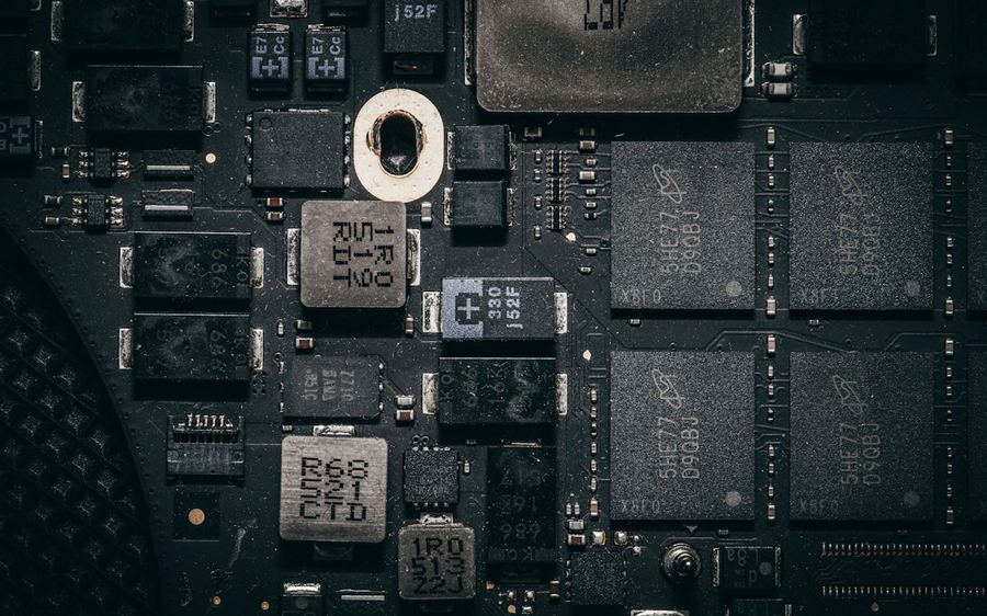 A dense circuit board photographed close, components in low light