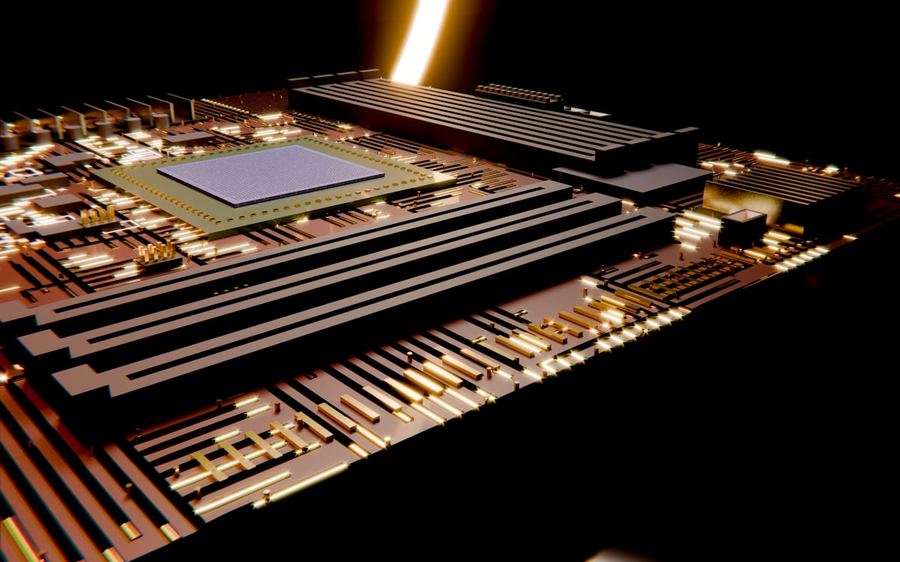 A processor die surrounded by gold traces under a warm light