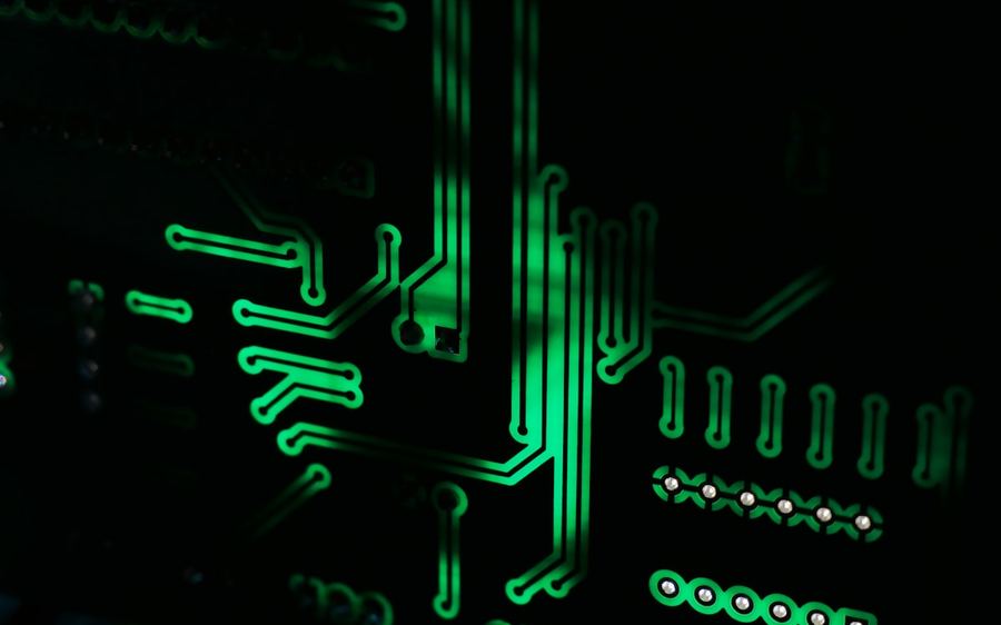 Circuit traces glowing green across a dark board